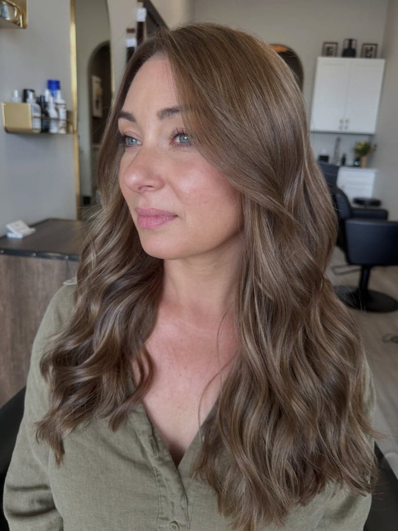 Low-maintenance "expensive brunette" with soft, fine dimension and face-framing layers — hair by Alchemy Loft