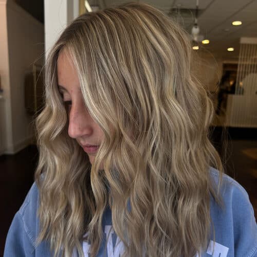 Sandy blonde balayage with long waves — hair by Alchemy Loft