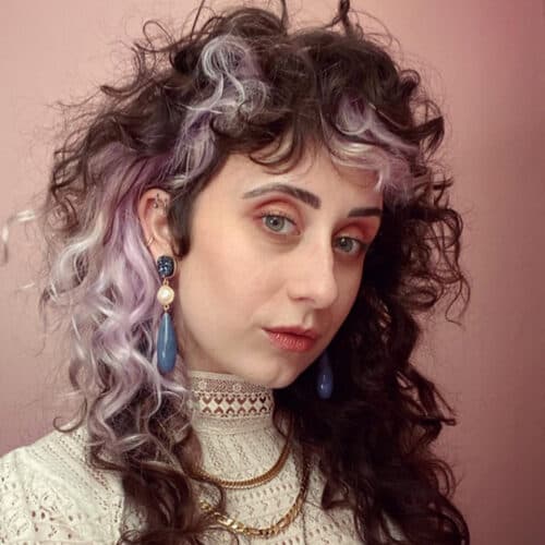 Dark curls with a silver money piece — hair by Alchemy Loft